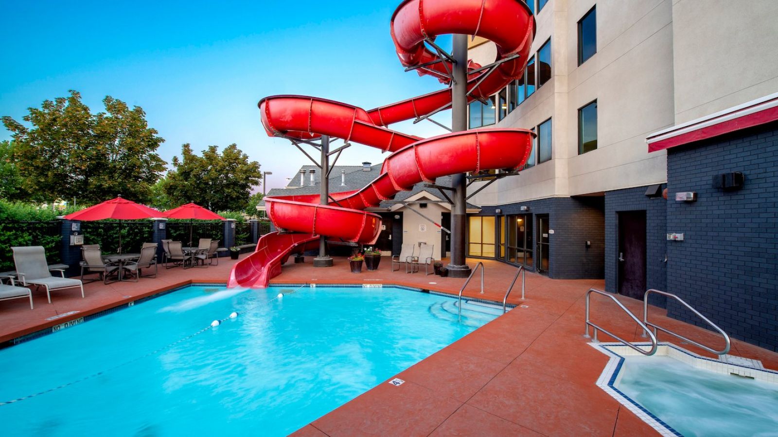 Our heated outdoor pool features a four-story waterslide.